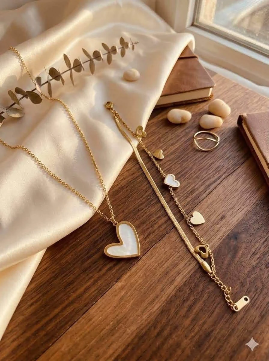 Heart necklace and bracelet arranged on a jewelry display